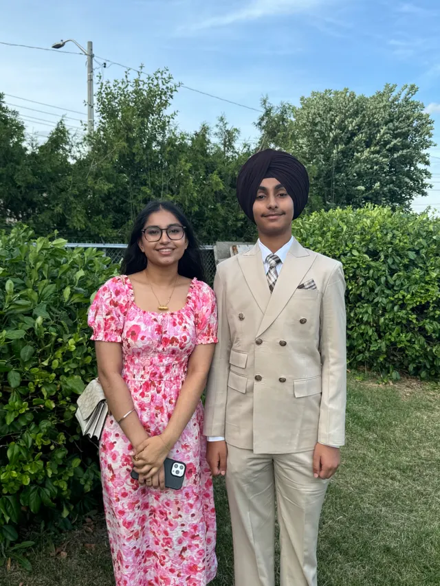 Together in traditional dress outdoors