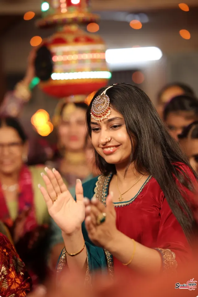 Dancing in red traditional wear